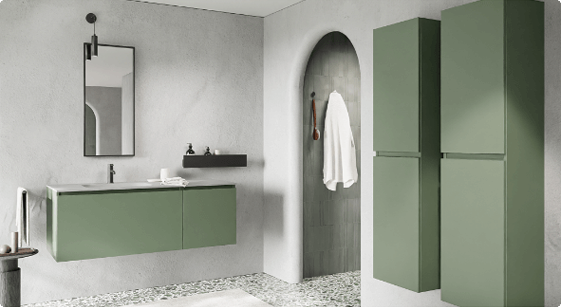 Design-x²o-Bad mit grünen Wandmöbeln und weißem Waschbecken, schwarzen Akzenten und passenden Accessoires. Rechts zwei hohe grüne Hochschränke. Der Boden hat eine Terrazzo-Optik, und der Zugang zur begehbaren Dusche ist durch einen Bogen gestaltet.