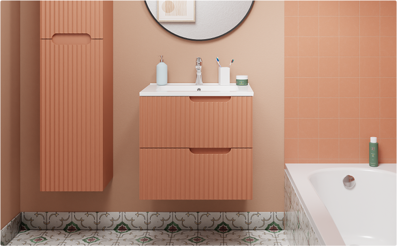Een warme badkamer met terracotta wandtegels, een bijpassend meubel met verticale groeven, een wit bad en sierlijke vloertegels. Deze stijlvolle inrichting is een typische x²o badkamers combinatie van kleur en functionaliteit.