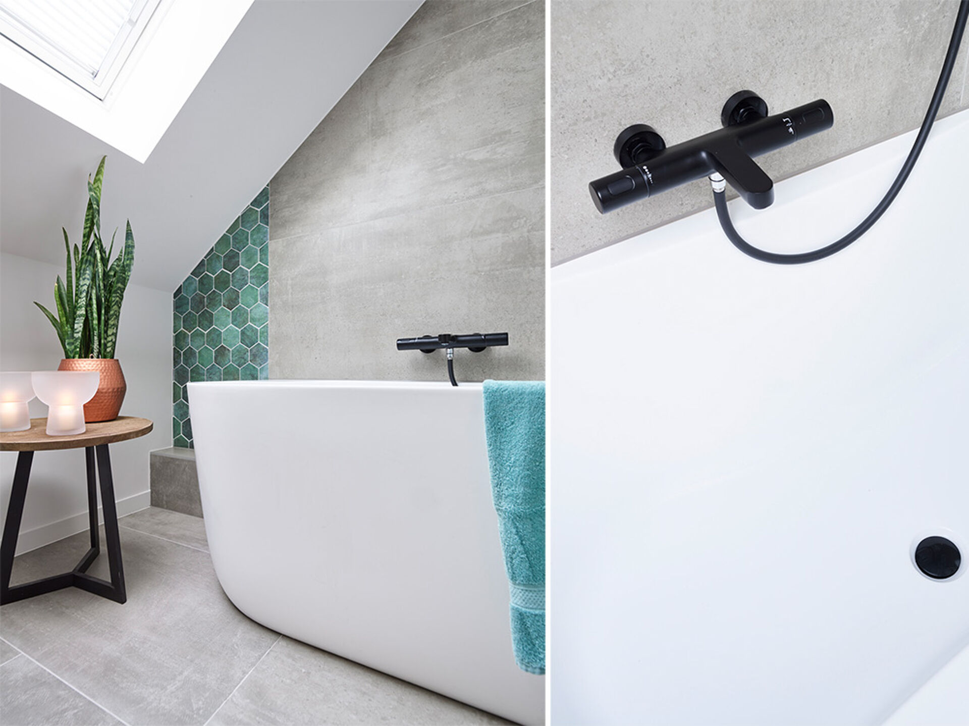 Badezimmer mit einer modernen Badewanne, schwarzem Wasserhahn, grünen Fliesen und einer Pflanze auf einem Holztisch.