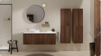 Moderne badkamermeubels met een ronde spiegel.